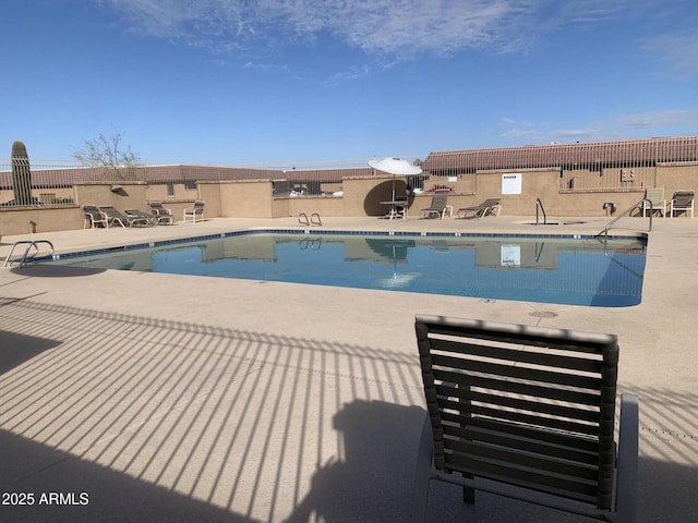 view of pool featuring a patio area