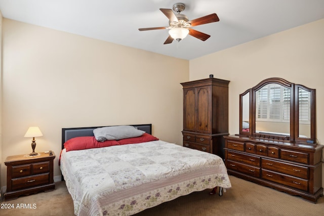 bedroom with ceiling fan and light colored carpet