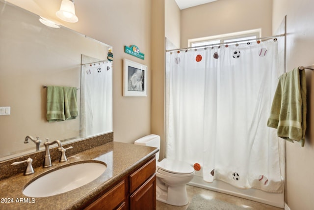 full bathroom with vanity, shower / bath combo with shower curtain, and toilet