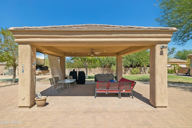 view of patio with a gazebo and ceiling fan