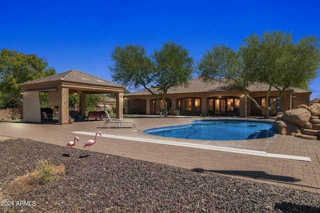 view of pool featuring a patio and a gazebo