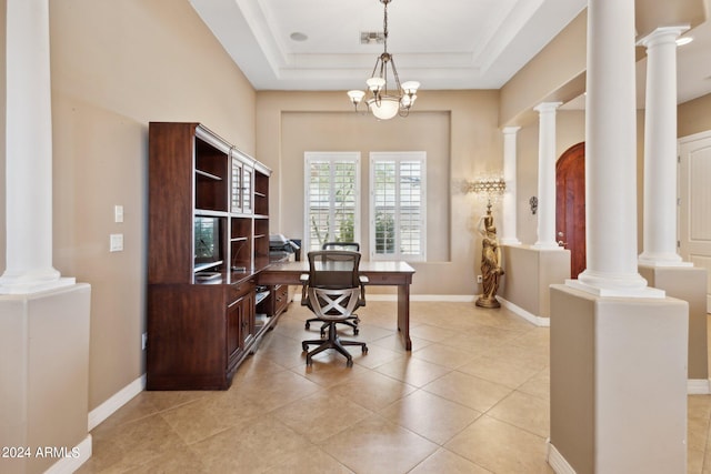 tiled office space featuring a tray ceiling and an inviting chandelier