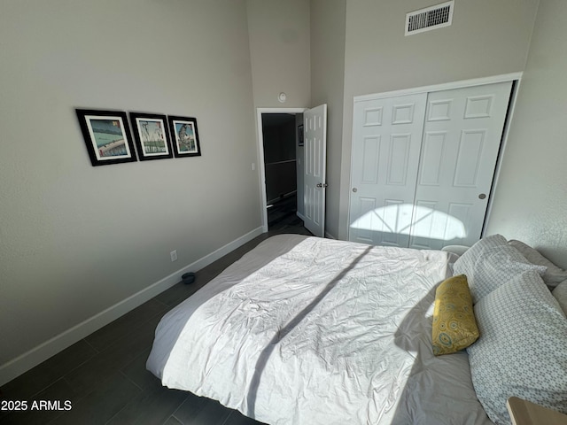 1060 E Louis Way, Tempe, AZ 85284 - bedroom with a closet, a high ceiling, and dark wood-type flooring