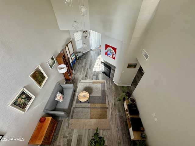 1060 E Louis Way, Tempe, AZ 85284 - living area with wood finished floors, a fireplace, and a towering ceiling