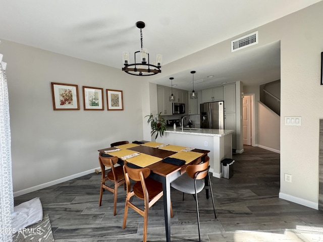 1060 E Louis Way, Tempe, AZ 85284 - dining room with a chandelier and dark wood-type flooring
