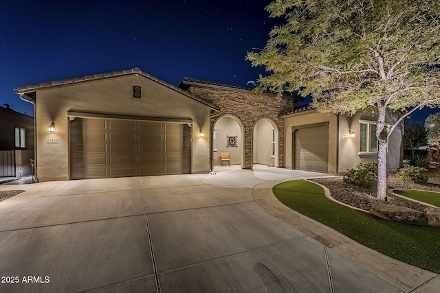 mediterranean / spanish-style house featuring a garage