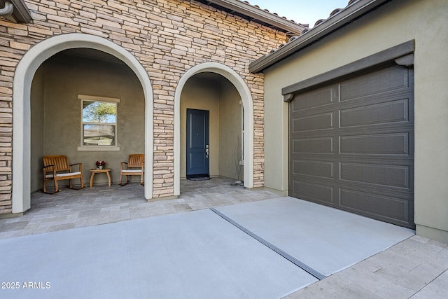 property entrance featuring a garage