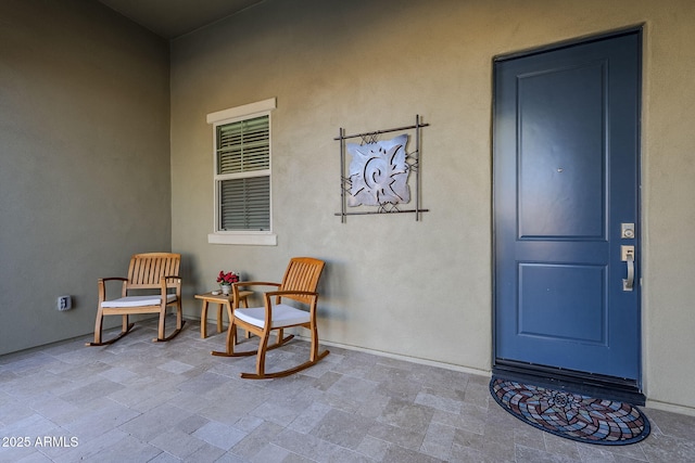 property entrance featuring a porch