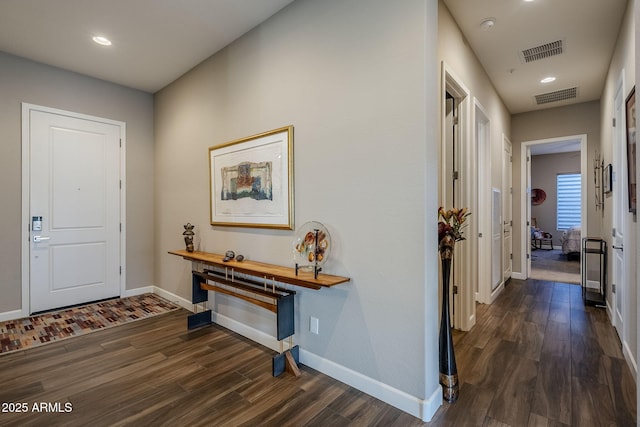 entryway with dark wood-type flooring