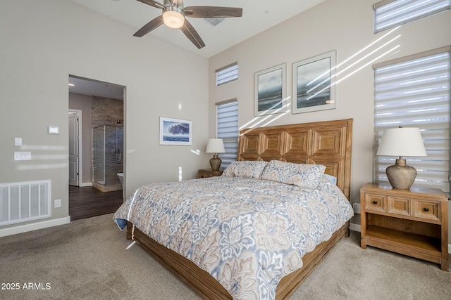 carpeted bedroom with ceiling fan and high vaulted ceiling