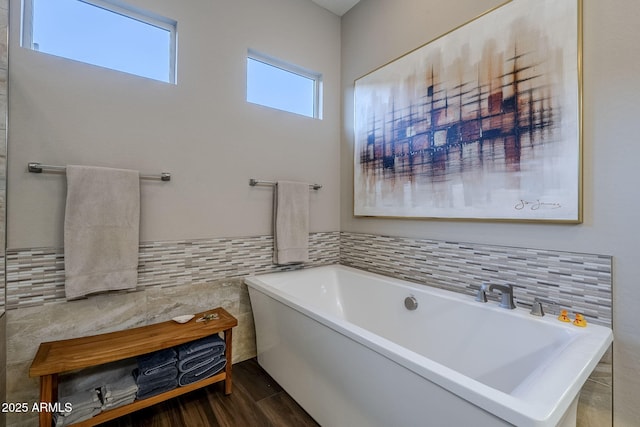 bathroom featuring hardwood / wood-style flooring and a bathtub