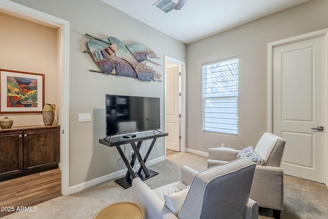 sitting room with light colored carpet