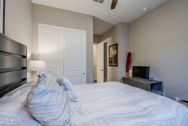 bedroom with ceiling fan and a closet