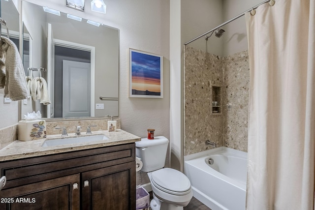 full bathroom featuring vanity, shower / tub combo, and toilet