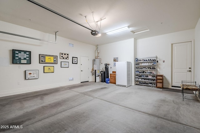 garage with white refrigerator, a garage door opener, and water heater