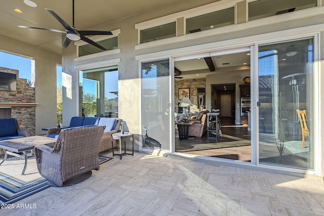 view of patio featuring outdoor lounge area and ceiling fan