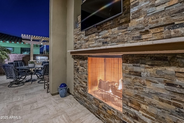 details with an outdoor fireplace