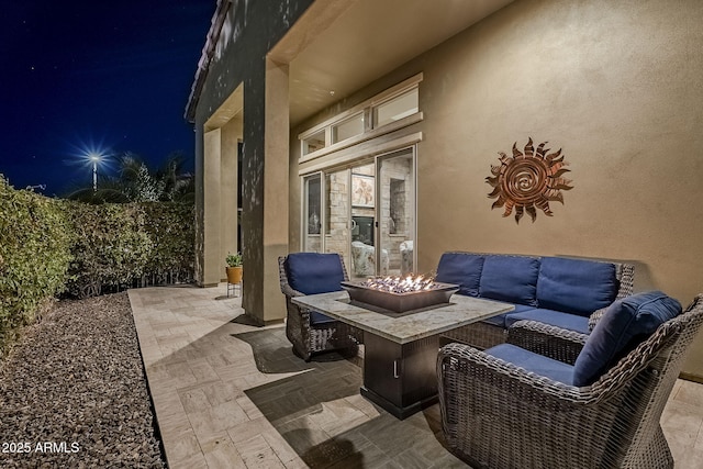 patio at twilight with an outdoor fire pit