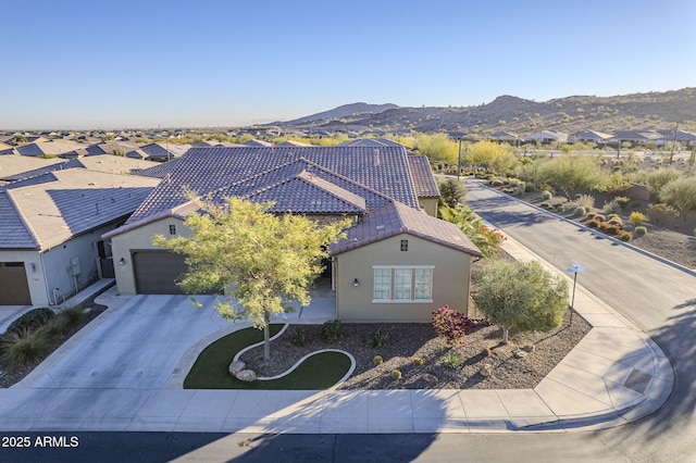 birds eye view of property with a mountain view