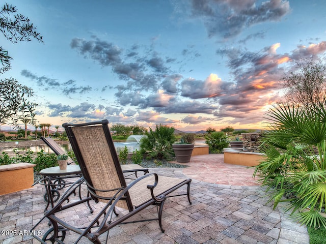 patio terrace at dusk with a water view