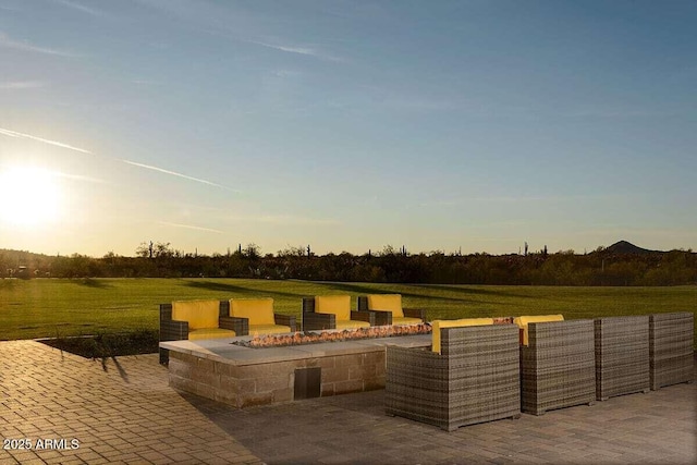 patio terrace at dusk with an outdoor fire pit