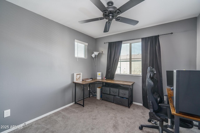 home office with light carpet, a wealth of natural light, and ceiling fan