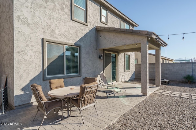 rear view of property featuring a patio