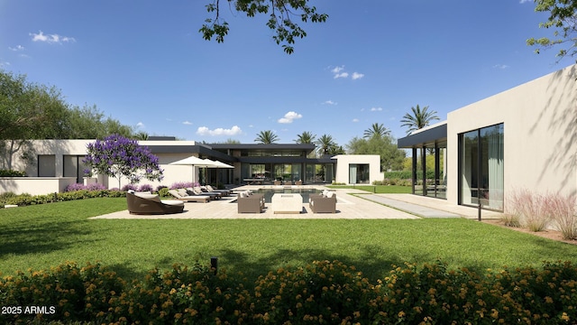 rear view of house with a patio, a lawn, outdoor lounge area, and stucco siding