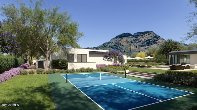 view of tennis court featuring a mountain view