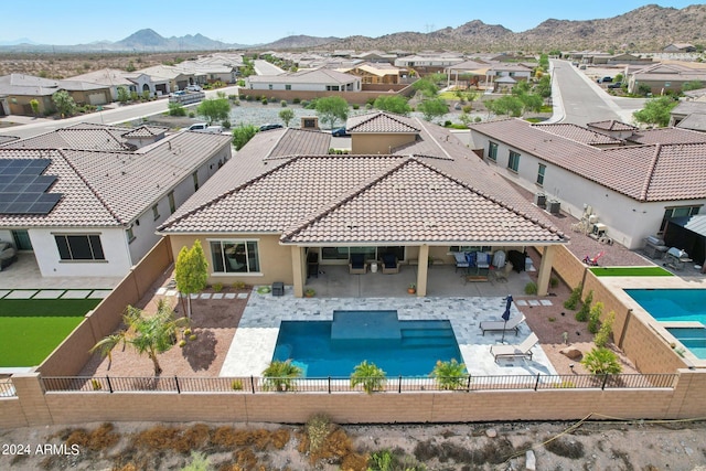 birds eye view of property featuring a mountain view and a residential view