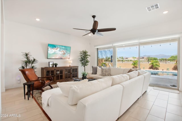 living room featuring recessed lighting, visible vents, and ceiling fan