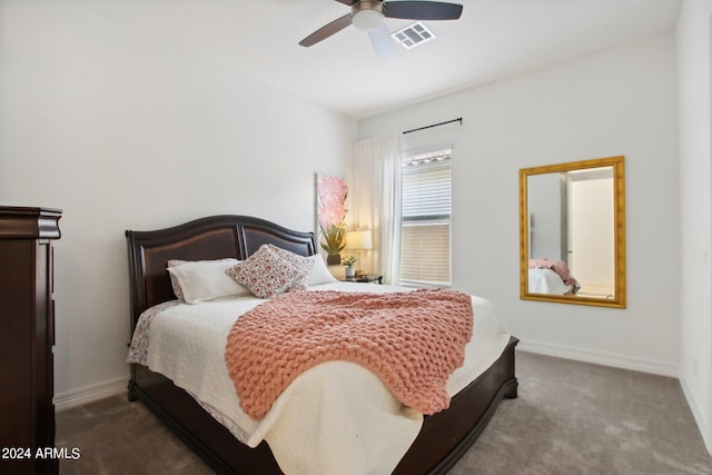 carpeted bedroom featuring visible vents, baseboards, and a ceiling fan