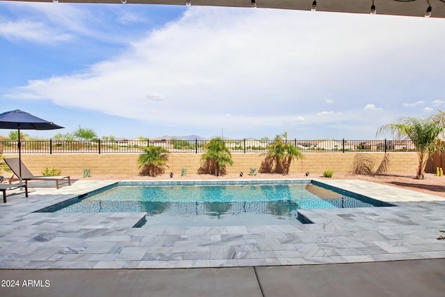 view of swimming pool with a fenced in pool and a fenced backyard