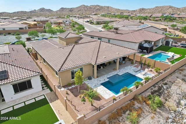 birds eye view of property with a residential view and a mountain view