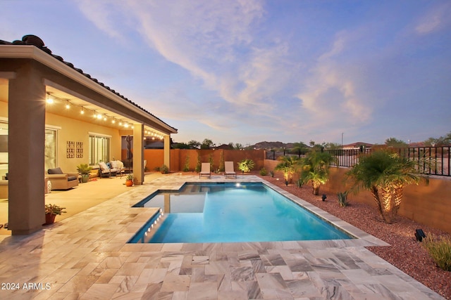 view of pool with a patio area, a fenced backyard, and a fenced in pool