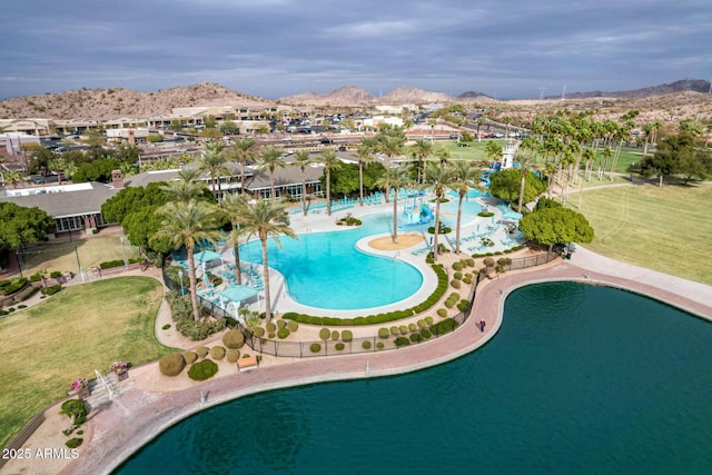 community pool with a mountain view