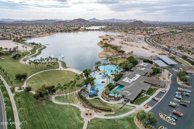 birds eye view of property featuring a water and mountain view