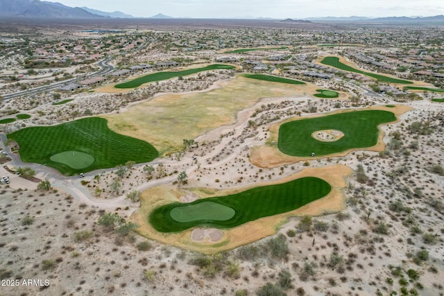 aerial view with a mountain view and golf course view