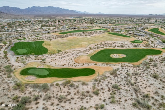 aerial view with view of golf course and a mountain view