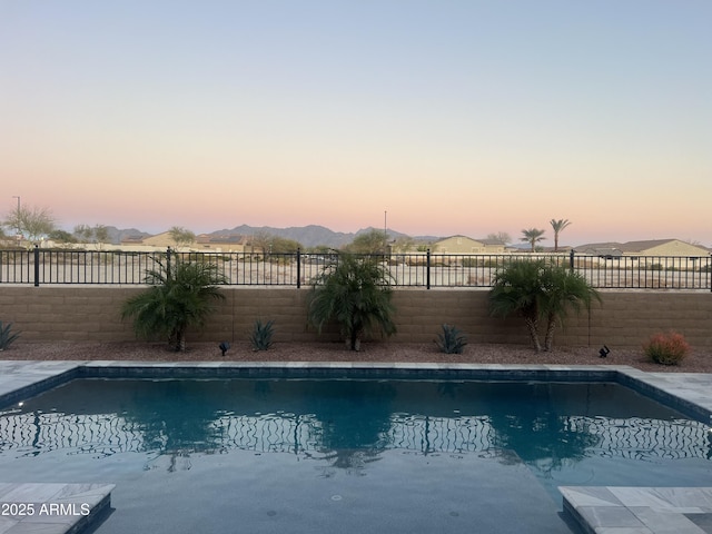 view of swimming pool featuring a fenced backyard