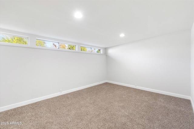 carpeted empty room with recessed lighting and baseboards