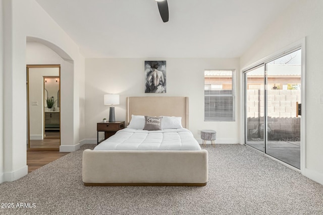 carpeted bedroom featuring access to exterior and ceiling fan