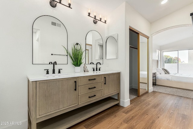 bathroom featuring vanity and wood-type flooring