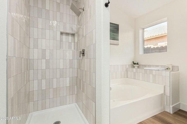 bathroom featuring separate shower and tub and wood-type flooring