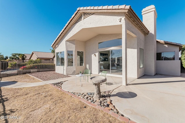 rear view of property with a patio