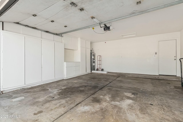 garage with a garage door opener and water heater