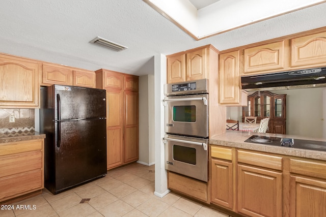 kitchen featuring black appliances, ventilation hood, decorative backsplash, light tile patterned floors, and a textured ceiling