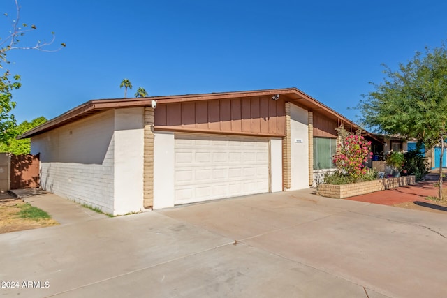 view of side of home featuring a garage