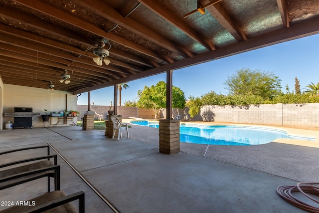 view of swimming pool featuring area for grilling and a patio area