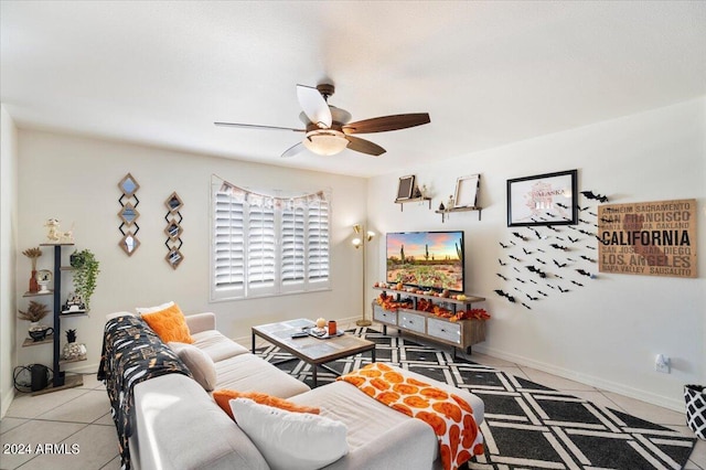 living room featuring light tile patterned floors and ceiling fan